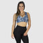 Best sports bra for comfort. Best activewear online for women. Sports wear with plus size women in mind. Wearing scrunch booty leggings in black. Leopard blue bra with zebra stripes and leopard print. 